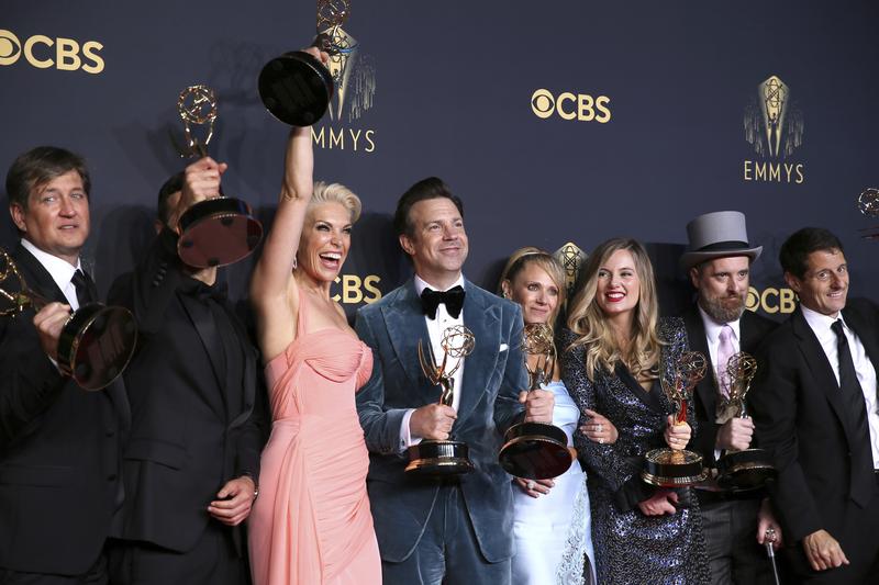 Hannah Waddingham, third from left, Jason Sudeikis, Juno Temple, and the team from "Ted Lasso" pose for a photo with their awards from the73rd Emmy Awards at the JW Marriott on Sunday, Sept. 19,