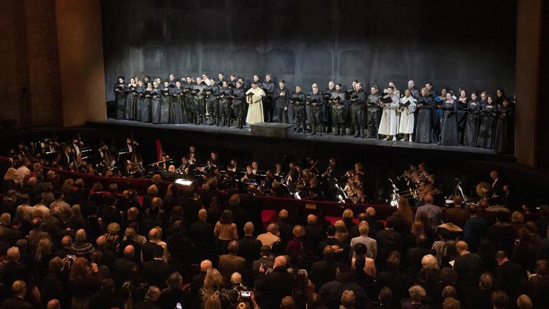The Metropolitan Opera orchestra and chorus performing the Ukrainian national anthem before the opening night performance of Verdi's "Don Carlos." 