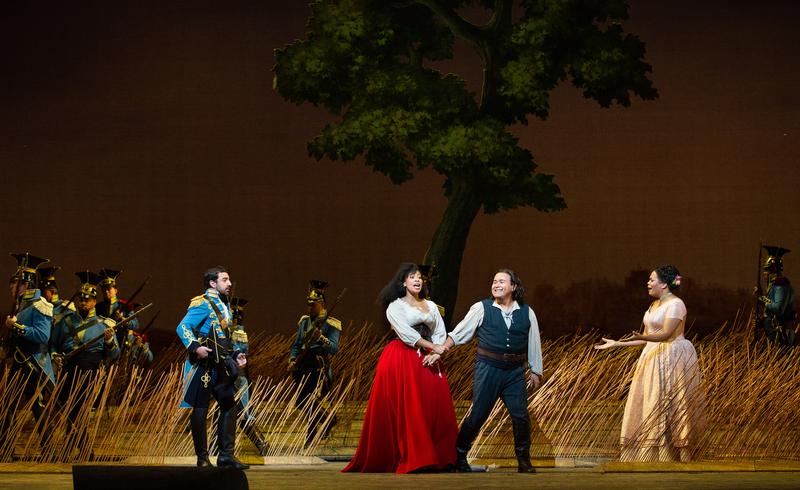 Davide Luciano as Belcore, Javier Camarena as Nemorino, Golda Schultz as Adina, and Brittany Renee as Giannetta in Donizetti's L'Elisir d'Amore.