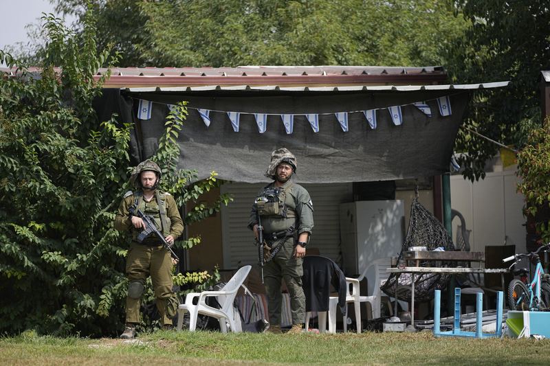 Israeli soldiers deploy in kibbutz Kfar Azza on Tuesday, Oct. 10, 2023. Hamas militants overran Kfar Azza on Saturday, where many Israelis were killed and taken captive.