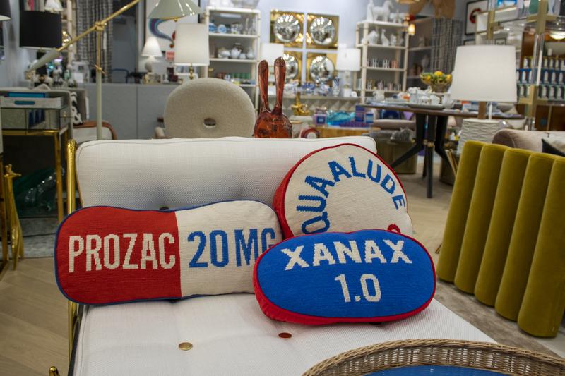 Pillows that look like a Prozac pill, a Xanas pill and a Quaalude pill are on display at a Jonathan Adler store in the American Dream shopping mall in East Rutherford, New Jersey, on Friday, October 6