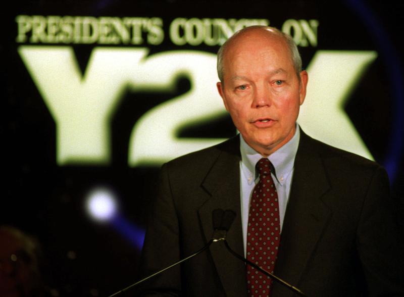 John Koskinen, chairman, President's Council on Y2K Conversion briefs reporters in Washington Dec. 31, 1999 on what's going on in the world as the year 2000 starts.