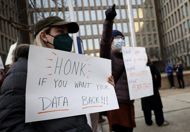 Protesters gather outside of the Theodore Roosevelt Federal Building headquarters of the U.S. Office of Personnel Management on February 03, 2025 in Washington, DC.