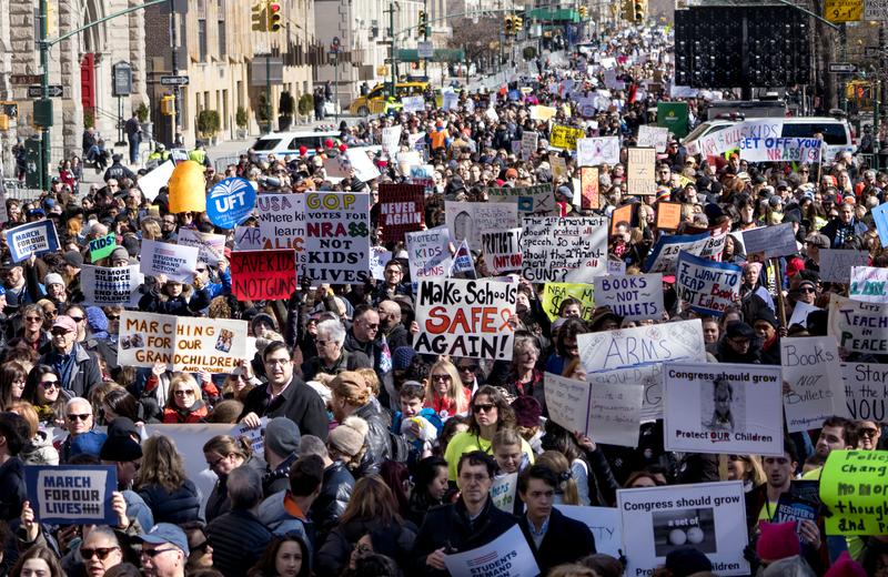 People take part in a march rally against gun violence Saturday, March 24, 2018, in New York