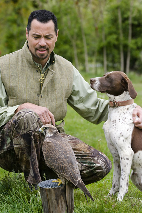 Mike Dupuy with Saker falcon, Hollywood, and pointer, Nila.