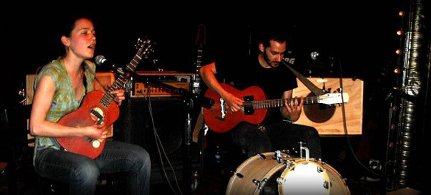 The players with their instruments: Arone Dyer with her buke, left, and Aron Sanchez with gass, right.