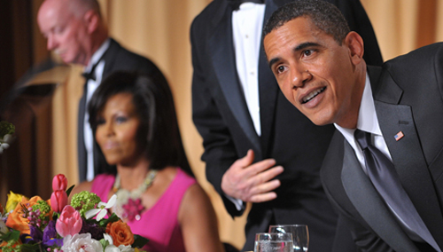President Barack Obama and First Lady Michelle Obama take their seats for the White House Correspondents Association annual dinner on May 9, 2009 at the Washington Hilton hotel in Washington. (MANDEL NGAN/AFP/Getty Images) 