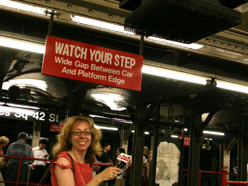 Reporter Beth Fertig gets some well-earned relief under a rare fan at the West end of the Times Square Shuttle. It was 91 degrees under the fan.
