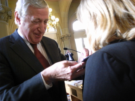French Ambassador Pierre Vimont knighting New York principal Giselle Gault McGee