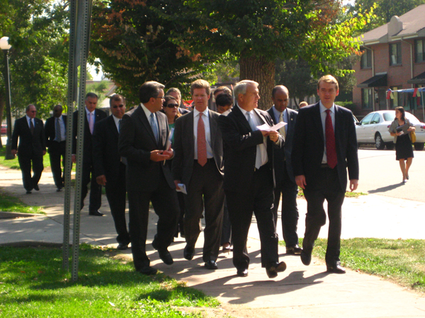 Carrion tours the South Lincoln Park housing Project in Denver with Housing and Urban Development Secretary Shaun Donovan, front row second from left (Andrea Bernstein)