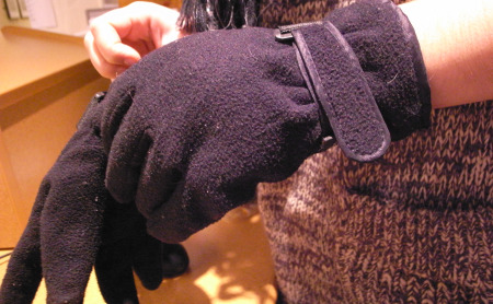 WNYC Newsroom intern Marine Olivesi sporting a “new” pair of gloves. (Photo by Stephen Nessen)