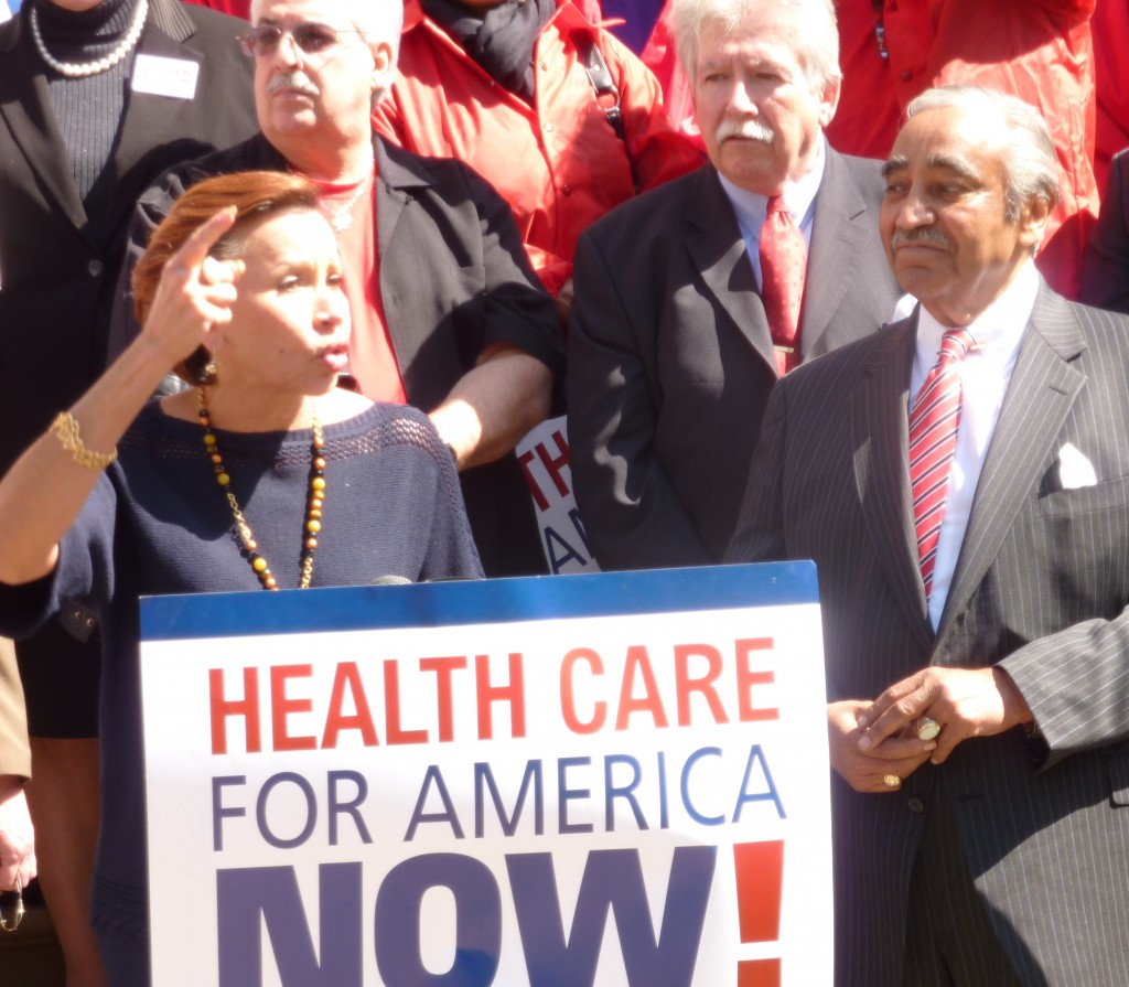 Representatives Nydia Velasquez and Charles Rangel praise activists, and activists praise them, during a celebration of health-care reform passage. (Photo by Fred Mogul)