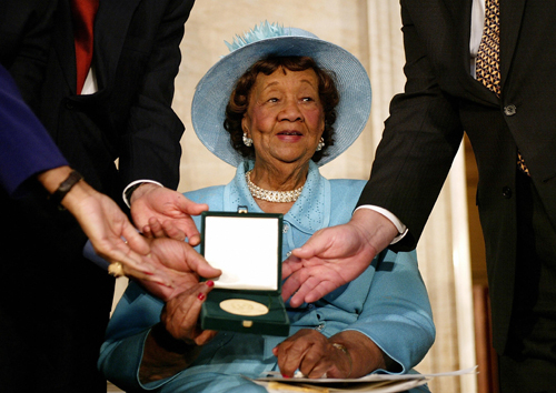 Dr. Dorothy Height is presented with the Congressional Gold Medal during a ceremony in the Rotunda at the Capitol 24 March, 2004. (Photo by Stephen Jaffe/AFP/Getty Images) 
